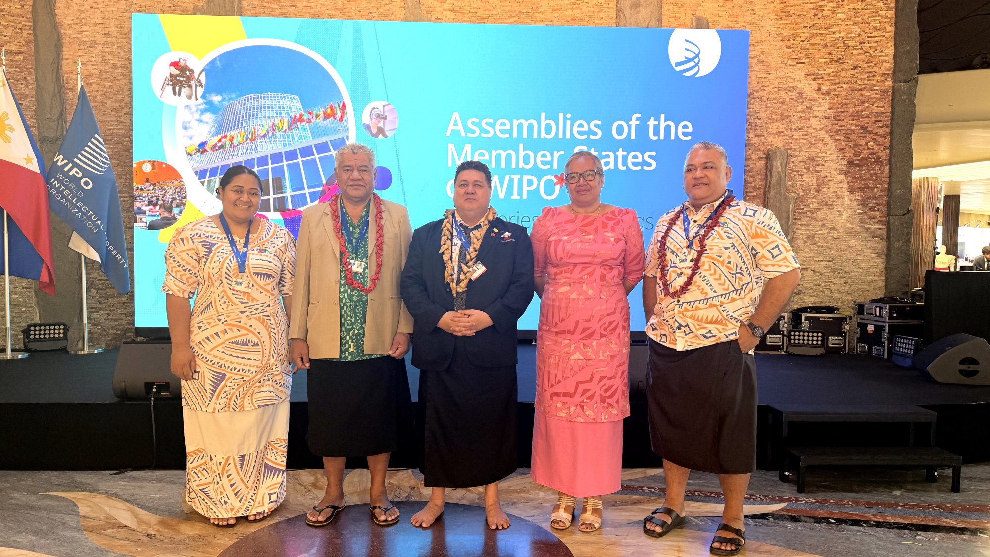 Minister Fata Ryan Schuster with the Samoa delegation in front of the WIPO Assemblies of the Member States backdrop in Geneva