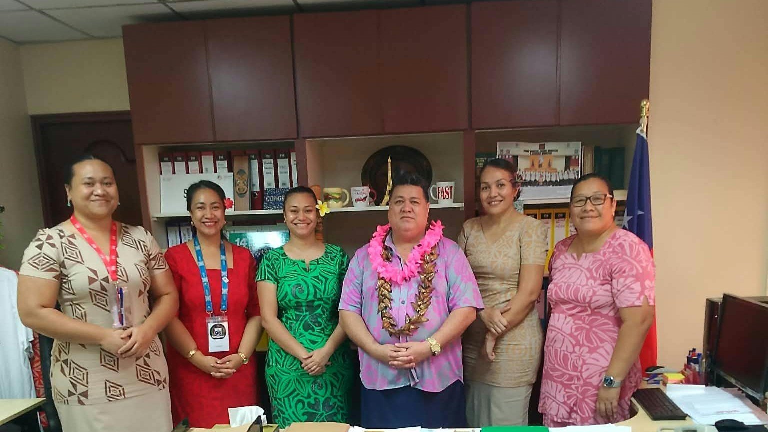 Minister Fata Ryan Schuster with five Ministry staff in his office